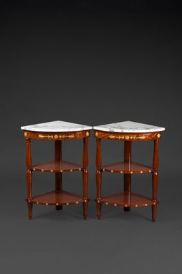 a pair of neoclassical style side tables with marble tops