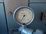 a close up of a pressure gauge on the side of a machine