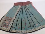 a close up of a skirt on a table with a white background