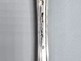 a spoon with a spoon handle on it on a table