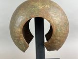 an image of a sculpture of a helmet on a black stand