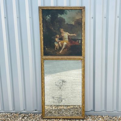 an image of a mirror with a painting on it in front of a building