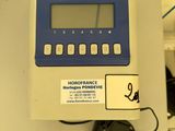 a blue and white electronic device sitting on a table