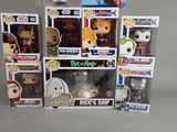 a bunch of pop vinyl figures on display in a display case