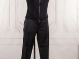 the mannequin is wearing a black jumpsuit and a black jacket