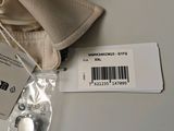 a small bag with a button and a tag on it