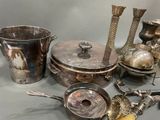 a lot of silver items that are on a table