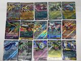 a bunch of pokemon cards sitting on top of a table