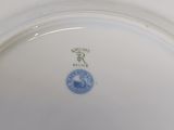 a white plate with a blue and white design on it