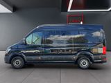 a black van that is parked in a parking lot