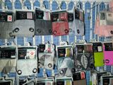many different types of electronic devices hanging on a wall