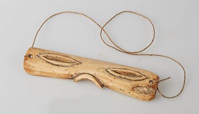 an image of a piece of wood with a face on it