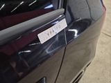 a sticker on the door of a car that says warning