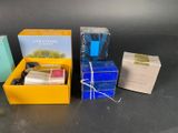 three boxes of soap, soap bars, and a soap bar are sitting on a table