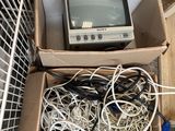 a box full of wires and a television in it