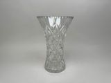 a glass vase that is sitting on a table