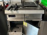 an image of a commercial kitchen with stainless steel appliances