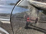 a reflection of a fire hydrant on the side of a car