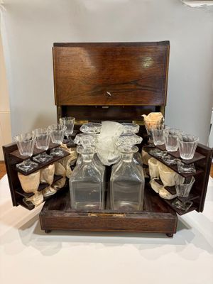 a wooden box with a bunch of empty glasses in it