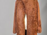 an image of a brown coat on a mannequin mannequin