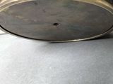 a metal bowl that is sitting on a table
