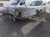 a small trailer with a trailer attached to it