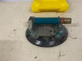 a yellow box sitting on top of a floor next to a blue machine