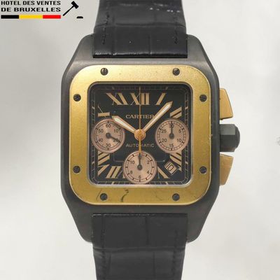 une image représentant une montre noire et dorée avec des chiffres romains