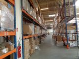 a large warehouse filled with lots of boxes and pallets