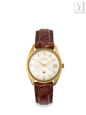une montre-bracelet plaquée or, avec un cadran blanc et un bracelet en cuir marron