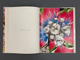 an open book with a picture of a bouquet of flowers on it