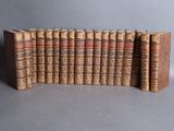 a group of old books stacked on top of each other