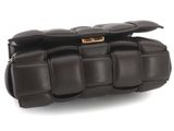 brown leather clutch bag on white background with gold hardware
