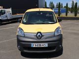 une camionnette jaune et noire garée sur un parking