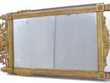 a mirror that is sitting on the wall