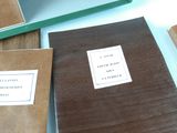 three books that are sitting on a table together