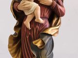 statue of a woman holding a baby in her arms