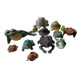 a lot of small figurines that are on a white surface