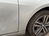a close up of a car ' s front wheel and tire