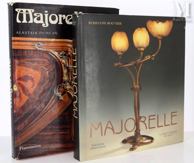 two books are sitting on a table next to each other