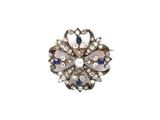 a close up of a ring with a flower design on it