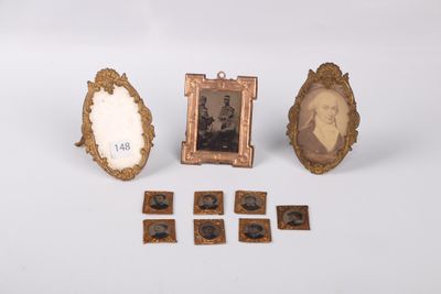 three framed pictures of a man and a woman and a picture of a man
