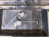 a picture of a pair of latches in a metal box