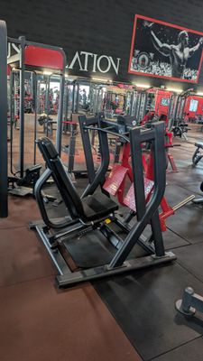 a large gym with a lot of machines in it