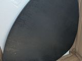 an image of a black chair in a cardboard box