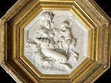 une image représentant un cadre doré orné d'un relief représentant un garçon et un chien