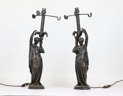 pair of art nouveau style bronze table lamps in the manner of person