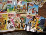 a lot of comic books on the table