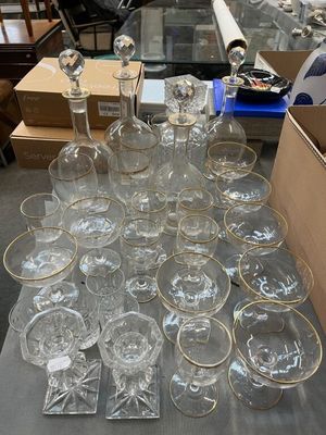 a lot of empty glasses on a table in a room