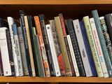a book shelf with many books on top of it